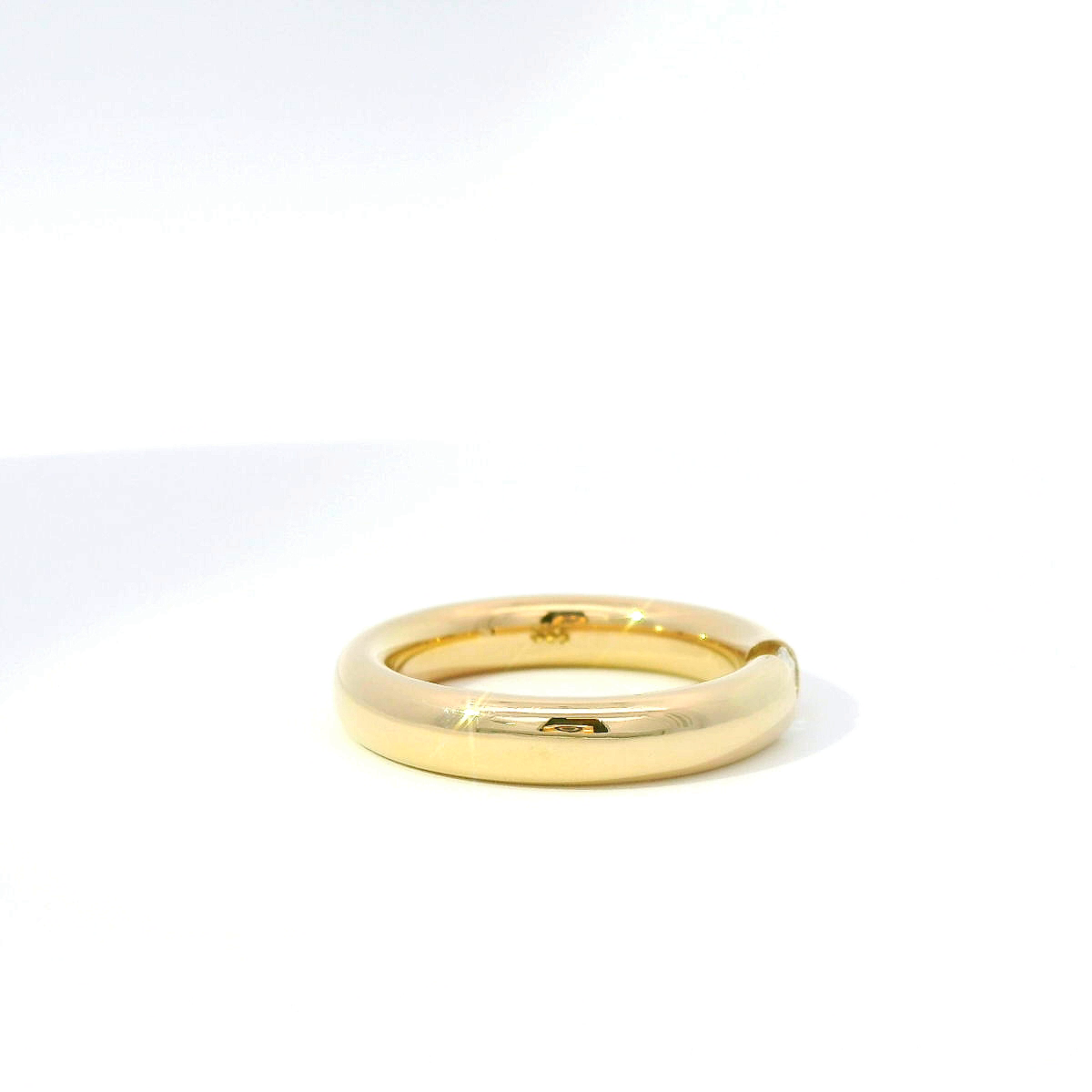 Spannring aus 14 Karat Gelbgold mit Brillant